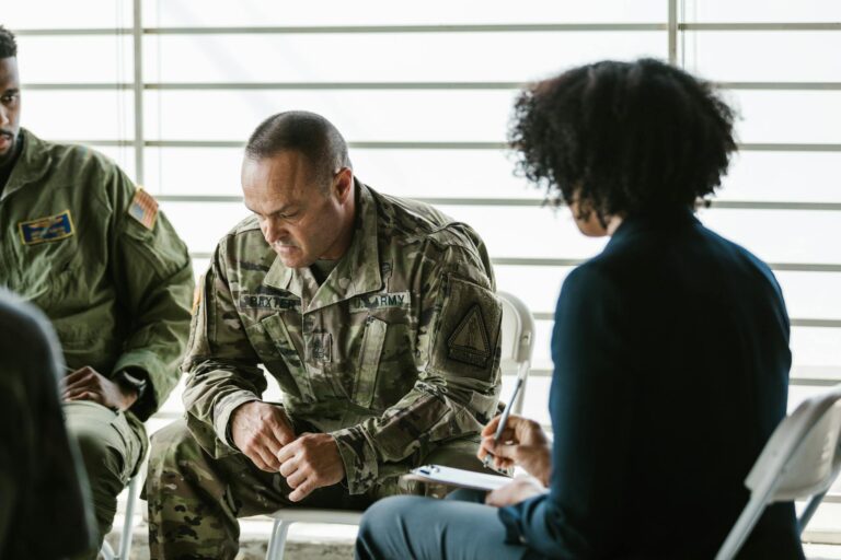 A therapy session for military veterans focusing on mental health and PTSD support.